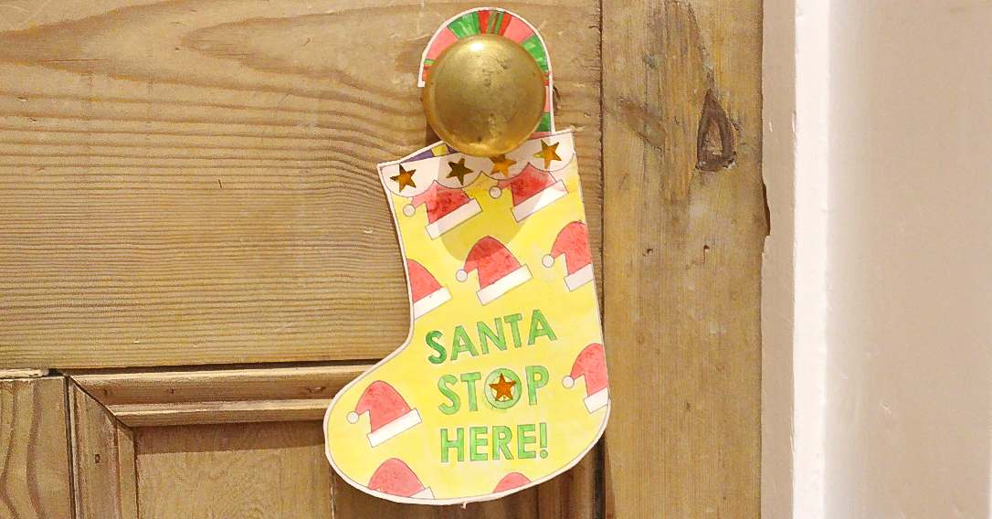 Beautiful Santa Stop Here door hanger template to download for free