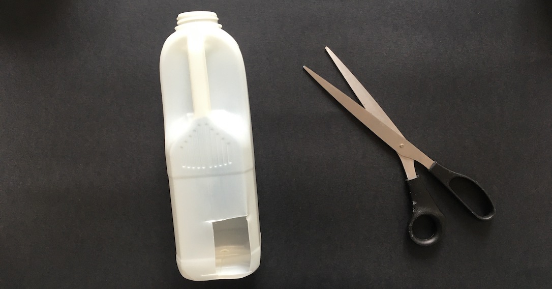 cut out a square under the milk bottle handle